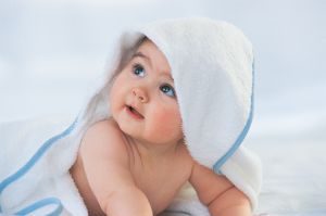 Baby Looking Up With a Towel Covering its Head