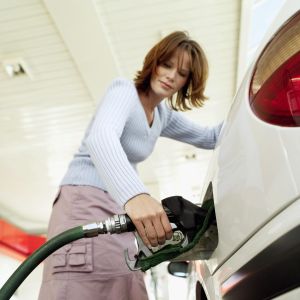 woman pumping gas