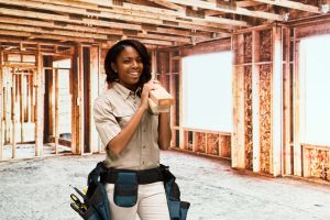 Smiling building contractor in construction site