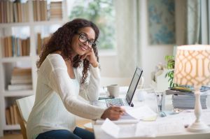 USA, New Jersey, Jersey City, Woman using laptop in home office