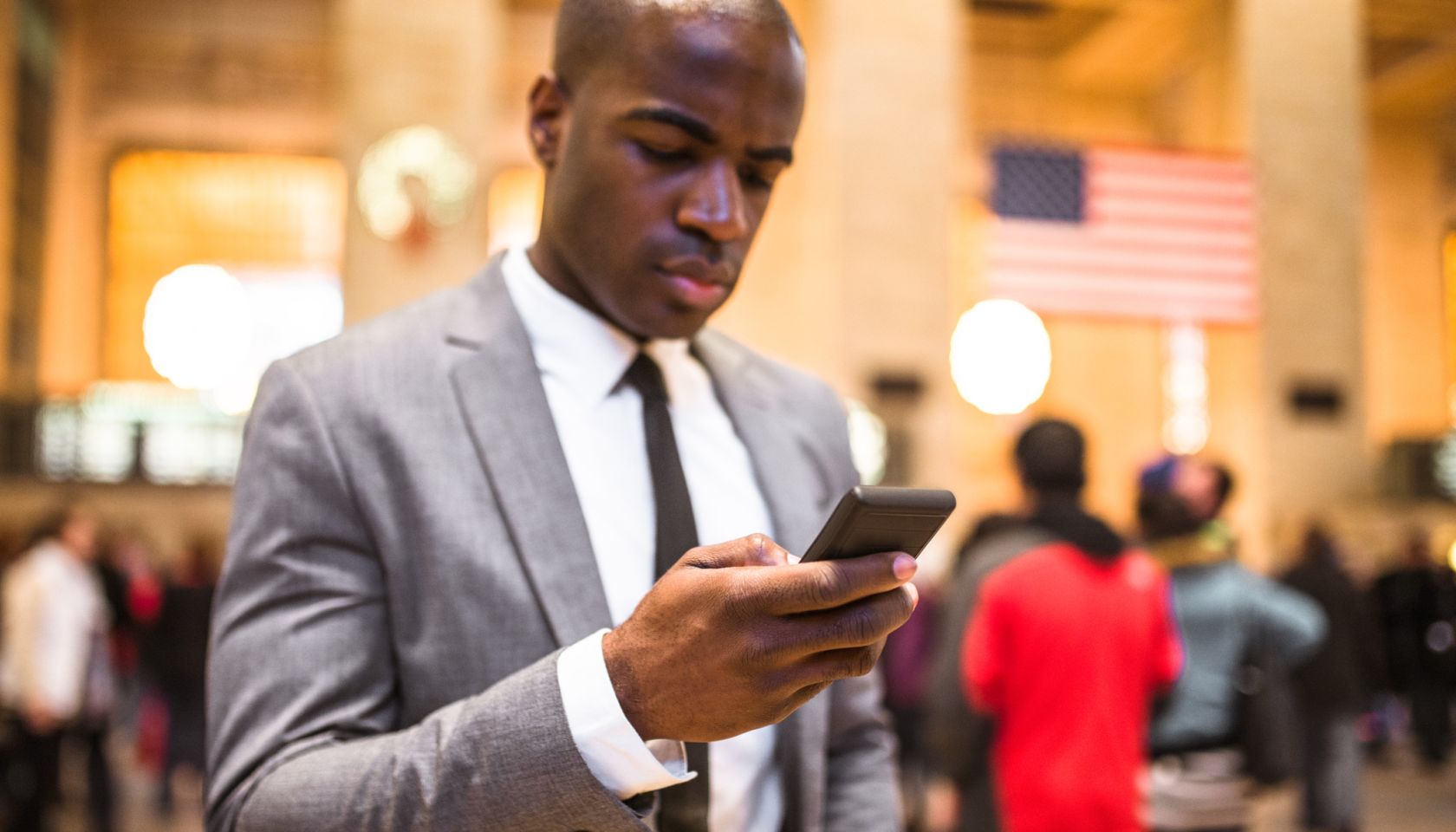 business man portrait in nyc sending sms