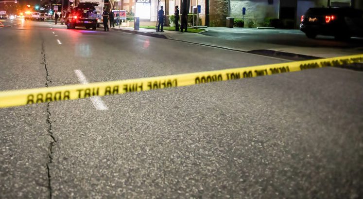 Police tape cordons off the building where the shooting...